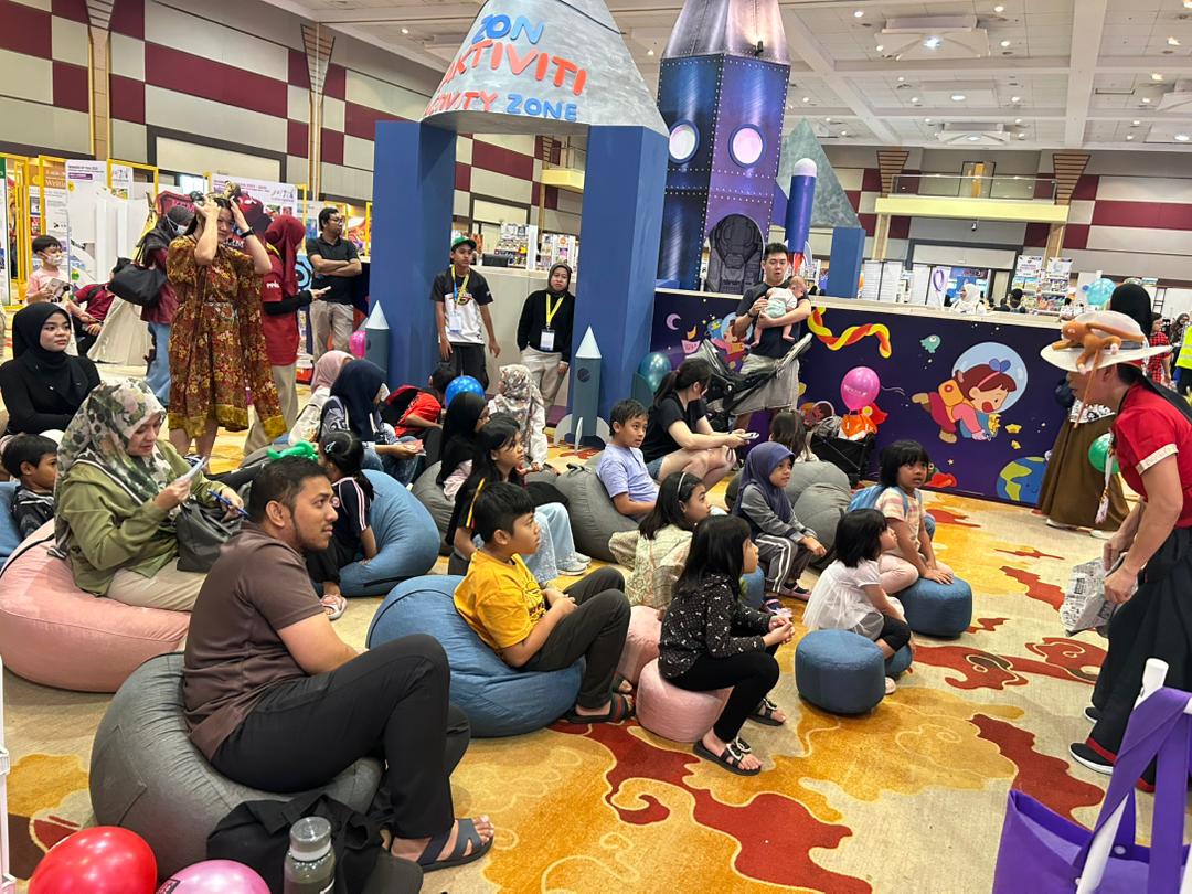Multi-generational Malaysian family reading together